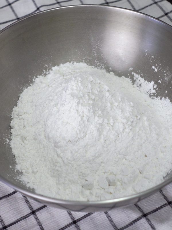 Glutinous rice flour, rice flour and salt in a steel bowl